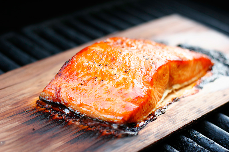 Photo of Cooked Salmon on Wood Plank