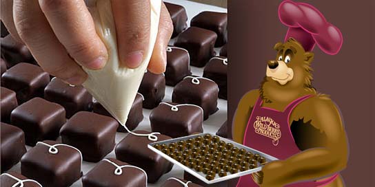 Photo of hand designed chocolates being made in an Alaska Wild Berry Candy Kitchen